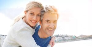 A man and woman smiling for the camera.