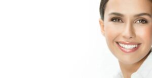 A woman with short hair smiles for the camera.