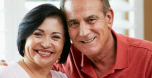 A man and woman smiling for the camera.